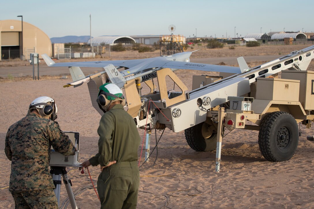 U.S. Marines with Marine Unmanned Aerial Vehicle Squadron (VMU) 1 set up and launch a RQ-21 "Blackjack" unmanned aerial vehicle (UAV) on Canon Air Defense Complex in Yuma, Arizona, Nov. 5, 2020. The RQ-21 is designed to support Marine Corps mission readiness by providing forward reconnaissance without having to put Marine Corps personnel at risk.(U.S. Marine Corps photo by Lance Cpl. John Hall)