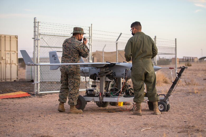 U.S. Marines with Marine Unmanned Aerial Vehicle Squadron (VMU) 1 set up and launch a RQ-21 "Blackjack" unmanned aerial vehicle (UAV) on Canon Air Defense Complex in Yuma, Arizona, Nov. 5, 2020. The RQ-21 is designed to support Marine Corps mission readiness by providing forward reconnaissance without having to put Marine Corps personnel at risk.(U.S. Marine Corps photo by Lance Cpl. John Hall)