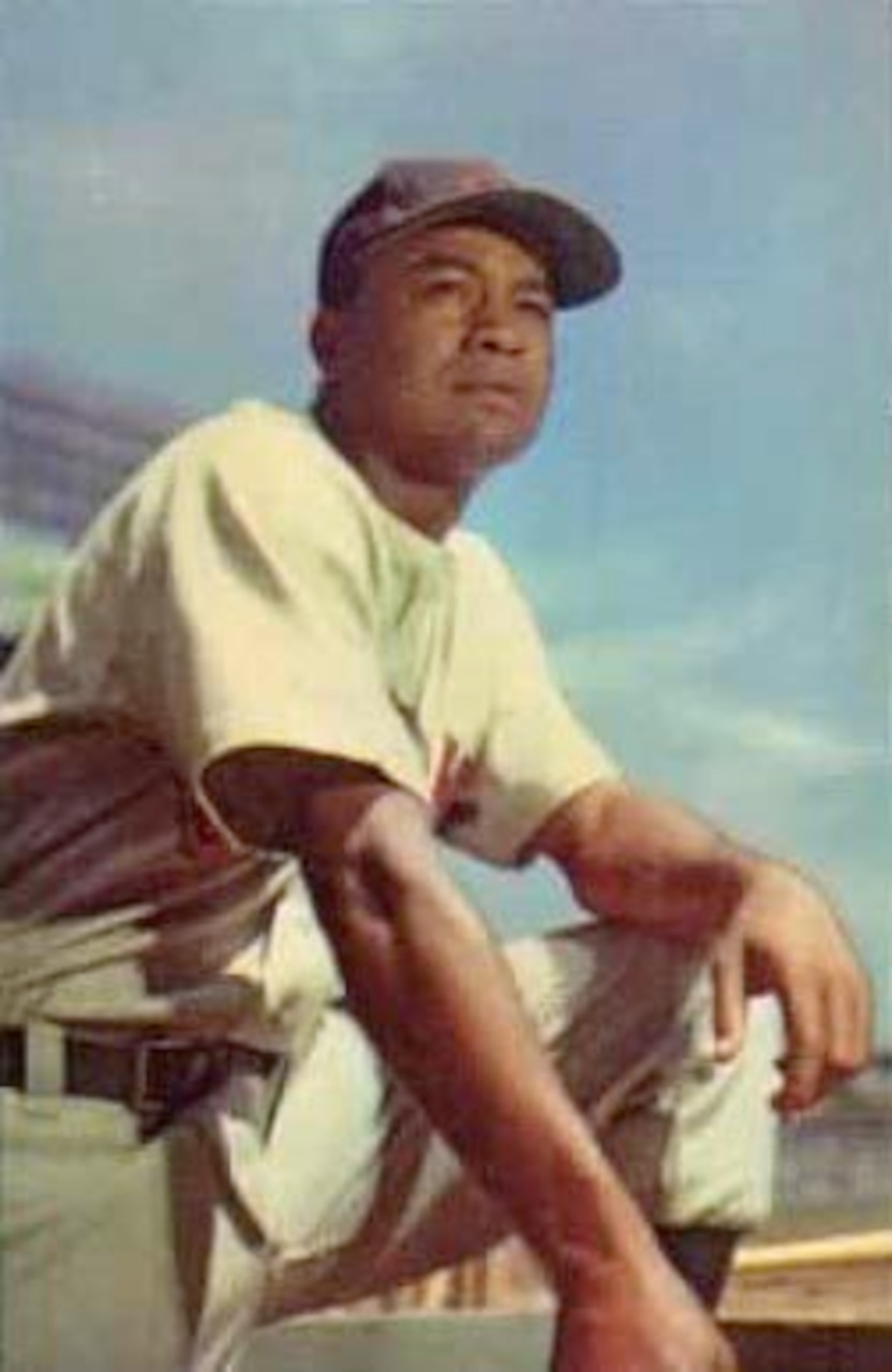 A baseball player poses for a photo.