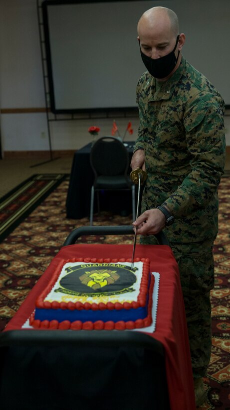 U.S. Marines with Headquarters and Headquarters Squadron conduct a ceremony celebrating the Marine Corps' 245th birthday aboard Marine Corps Air Station Yuma on Nov. 13, 2020. This event allowed Marines to participate in the customary traditions while following COVID-19 guidelines. ( U.S. Marine Corps photo by Cpl. Jason Monty)