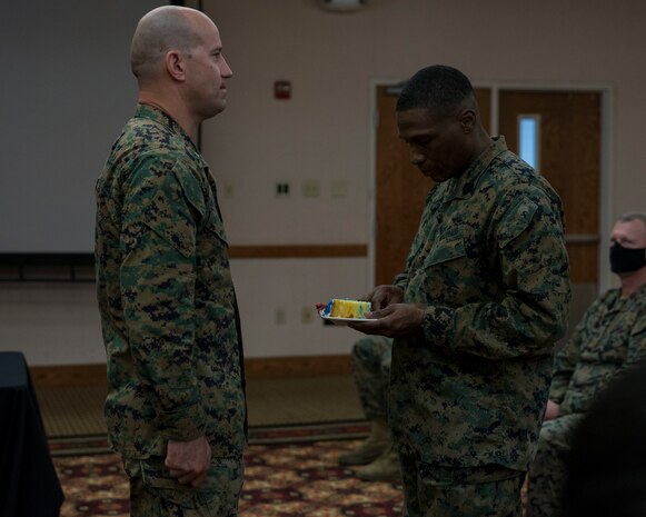 U.S. Marines with Headquarters and Headquarters Squadron conduct a ceremony celebrating the Marine Corps' 245th birthday aboard Marine Corps Air Station Yuma on Nov. 13, 2020. This event allowed Marines to participate in the customary traditions while following COVID-19 guidelines. ( U.S. Marine Corps photo by Cpl. Jason Monty)