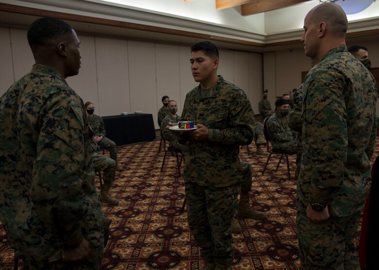 U.S. Marines with Headquarters and Headquarters Squadron conduct a ceremony celebrating the Marine Corps' 245th birthday aboard Marine Corps Air Station Yuma on Nov. 13, 2020. This event allowed Marines to participate in the customary traditions while following COVID-19 guidelines. ( U.S. Marine Corps photo by Cpl. Jason Monty)