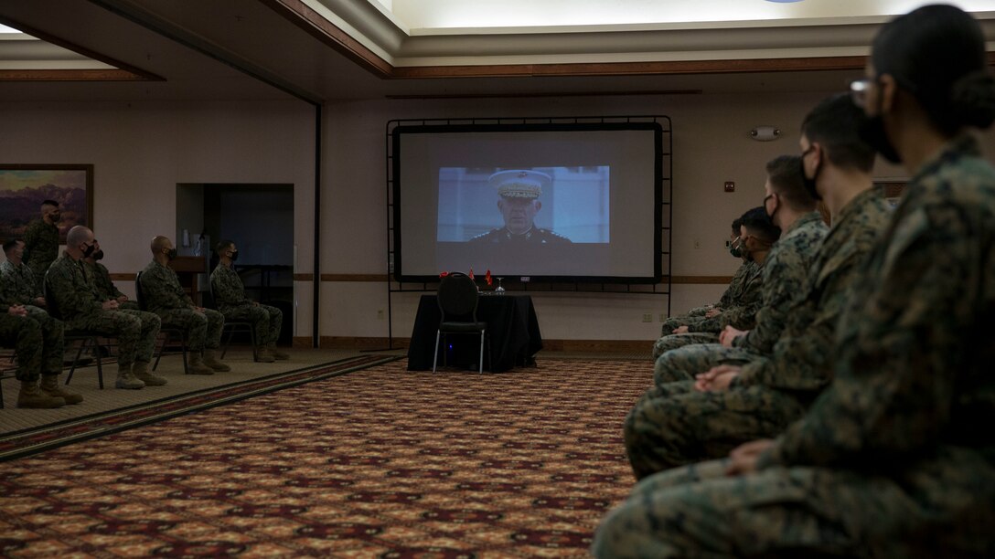 U.S. Marines with Headquarters and Headquarters Squadron conduct a ceremony celebrating the Marine Corps' 245th birthday aboard Marine Corps Air Station Yuma on Nov. 13, 2020. This event allowed Marines to participate in the customary traditions while following COVID-19 guidelines. ( U.S. Marine Corps photo by Cpl. Jason Monty)