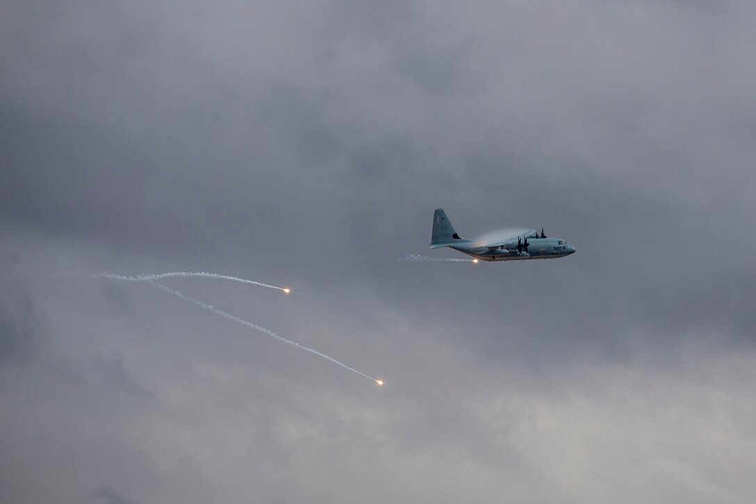 A KC-130J with Marine Aerial Refueler Transport Squadron (VMGR) 152 expends countermeasure flares to defeat a simulated surface-to-air missile, or Smokey Sam at Barry M. Goldwater Range West aboard Marine Corps Air Station Yuma training grounds, Jan 21, 2021.  The Smokey Sam tests the aircraft’s electronic countermeasure systems and ensures that flares are expended to defeat the infrared threat.  (U.S. Marine Corps photo by LCpl. Gabrielle Sanders)