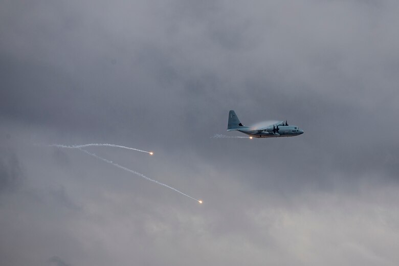 A KC-130J with Marine Aerial Refueler Transport Squadron (VMGR) 152 expends countermeasure flares to defeat a simulated surface-to-air missile, or Smokey Sam at Barry M. Goldwater Range West aboard Marine Corps Air Station Yuma training grounds, Jan 21, 2021.  The Smokey Sam tests the aircraft’s electronic countermeasure systems and ensures that flares are expended to defeat the infrared threat.  (U.S. Marine Corps photo by LCpl. Gabrielle Sanders)