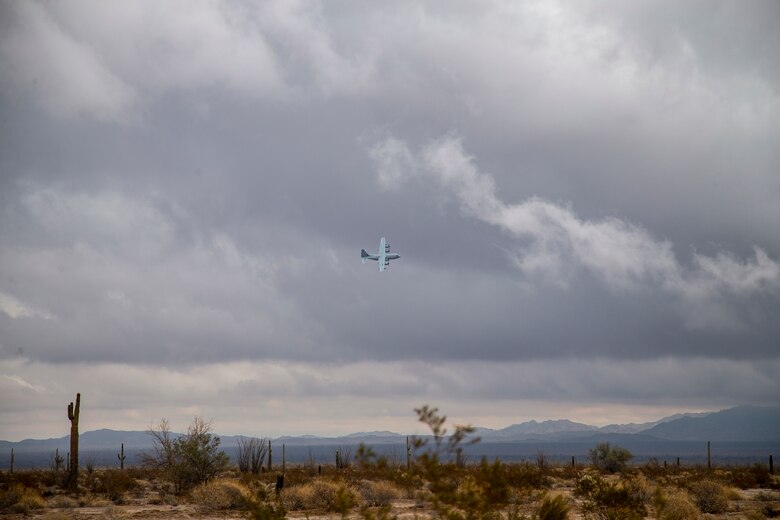 A KC-130J with Marine Aerial Refueler Transport Squadron (VMGR) 152 expends countermeasure flares to defeat a simulated surface-to-air missile, or Smokey Sam at Barry M. Goldwater Range West aboard Marine Corps Air Station Yuma training grounds, Jan 21, 2021.  The Smokey Sam tests the aircraft’s electronic countermeasure systems and ensures that flares are expended to defeat the infrared threat.  (U.S. Marine Corps photo by LCpl. Gabrielle Sanders)
