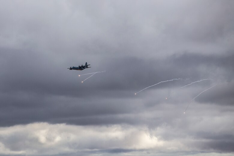 A KC-130J with Marine Aerial Refueler Transport Squadron (VMGR) 152 expends countermeasure flares to defeat a simulated surface-to-air missile, or Smokey Sam at Barry M. Goldwater Range West aboard Marine Corps Air Station Yuma training grounds, Jan 21, 2021.  The Smokey Sam tests the aircraft’s electronic countermeasure systems and ensures that flares are expended to defeat the infrared threat.  (U.S. Marine Corps photo by LCpl. Gabrielle Sanders)