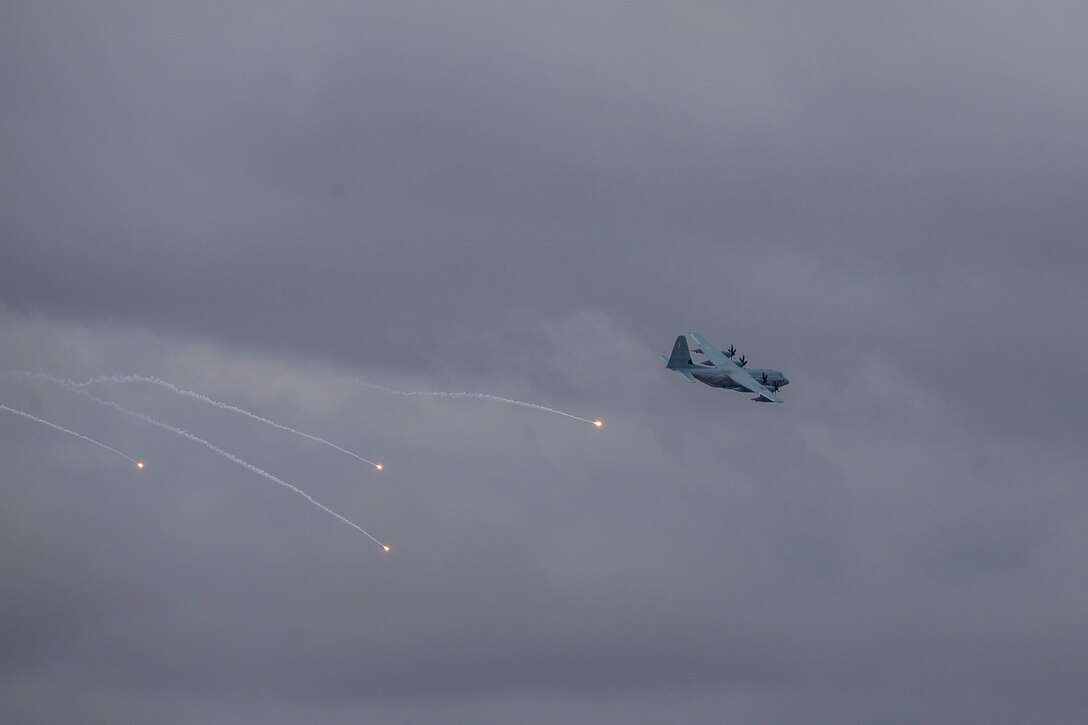 A KC-130J with Marine Aerial Refueler Transport Squadron (VMGR) 152 expends countermeasure flares to defeat a simulated surface-to-air missile, or Smokey Sam at Barry M. Goldwater Range West aboard Marine Corps Air Station Yuma training grounds, Jan. 21, 2021.