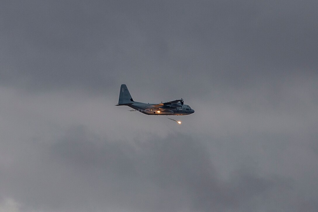 A KC-130J with Marine Aerial Refueler Transport Squadron (VMGR) 152 expends countermeasure flares to defeat a simulated surface-to-air missile, or Smokey Sam at Barry M. Goldwater Range West aboard Marine Corps Air Station Yuma training grounds, Jan 21, 2021.  The Smokey Sam tests the aircraft’s electronic countermeasure systems and ensures that flares are expended to defeat the infrared threat.  (U.S. Marine Corps photo by LCpl. Gabrielle Sanders)
