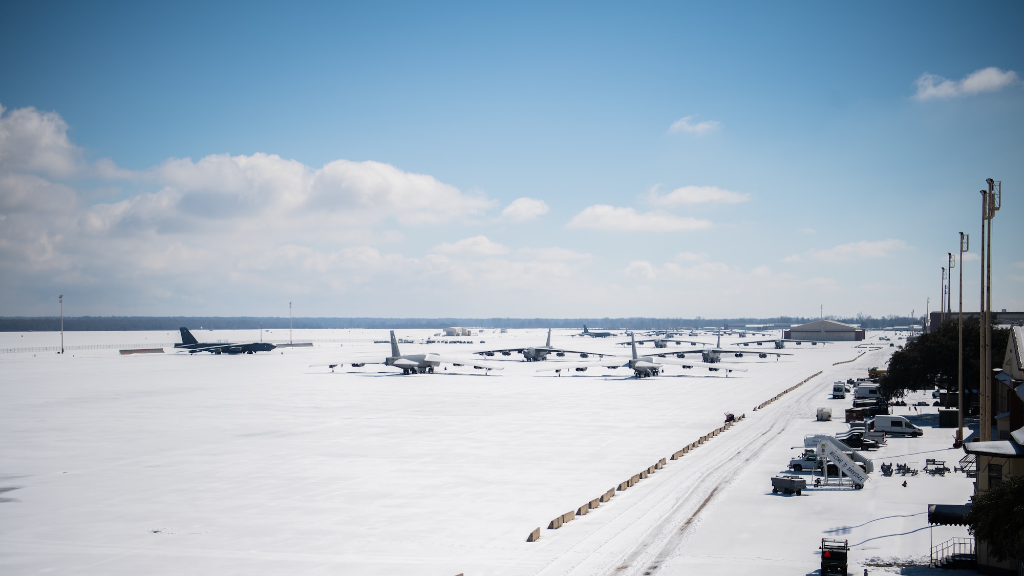 Snow covered B-52H Stratofortresses sit on the flightline at Barksdale Air Force Base, La., Feb. 19, 2021. Barksdale measured approximately four inches of snow Feb. 14 and 15. An additional two inches of snow and sleet were recorded on Feb. 17. (U.S. Air Force photo by Airman 1st Class Jacob B. Wrightsman)