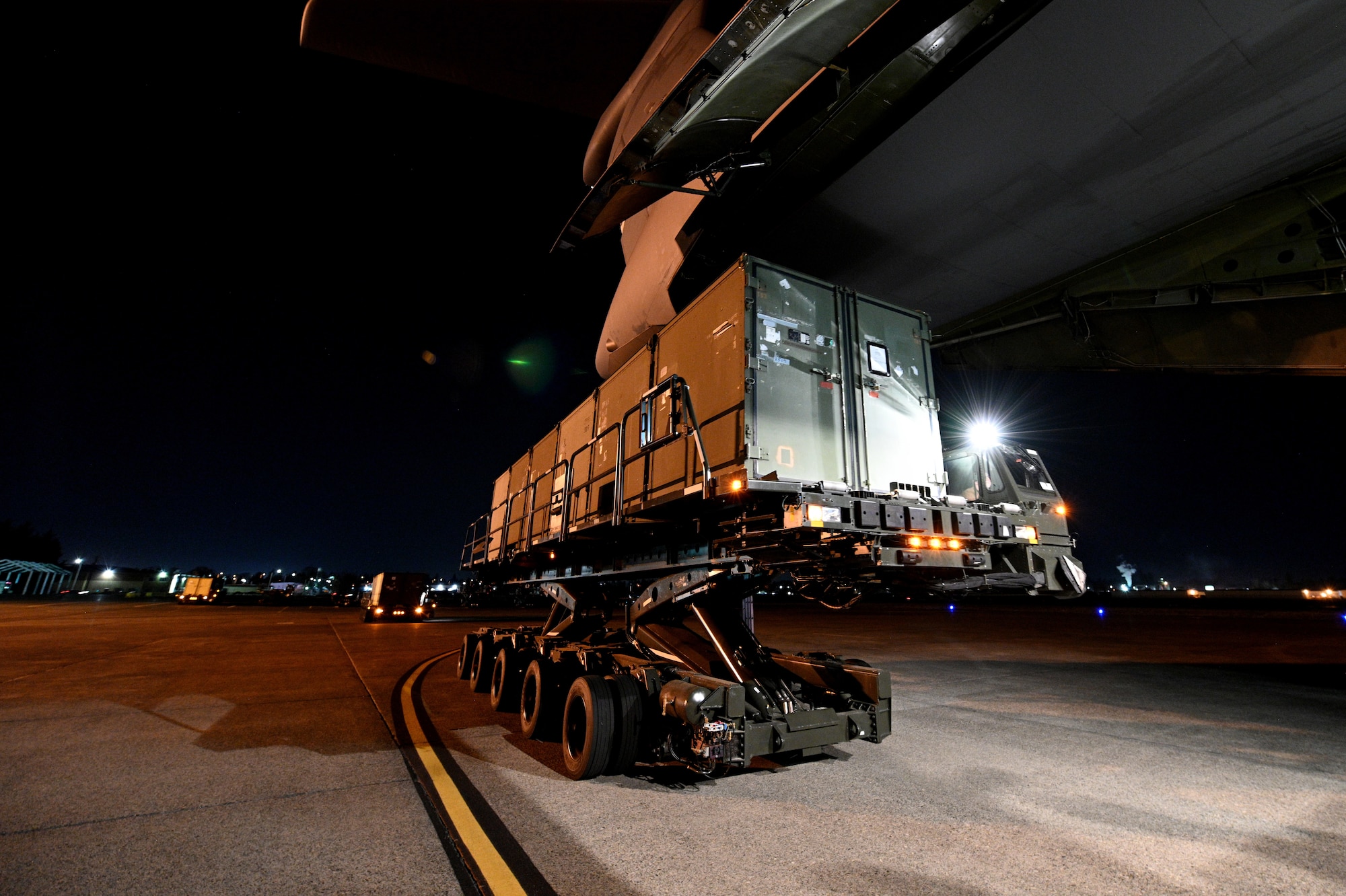 Photos of Airmen loading cargo onto a C-5M Super Galaxy at JBLM and delivering the cargo to Joint Base Pearl Harbor, Hawaii.