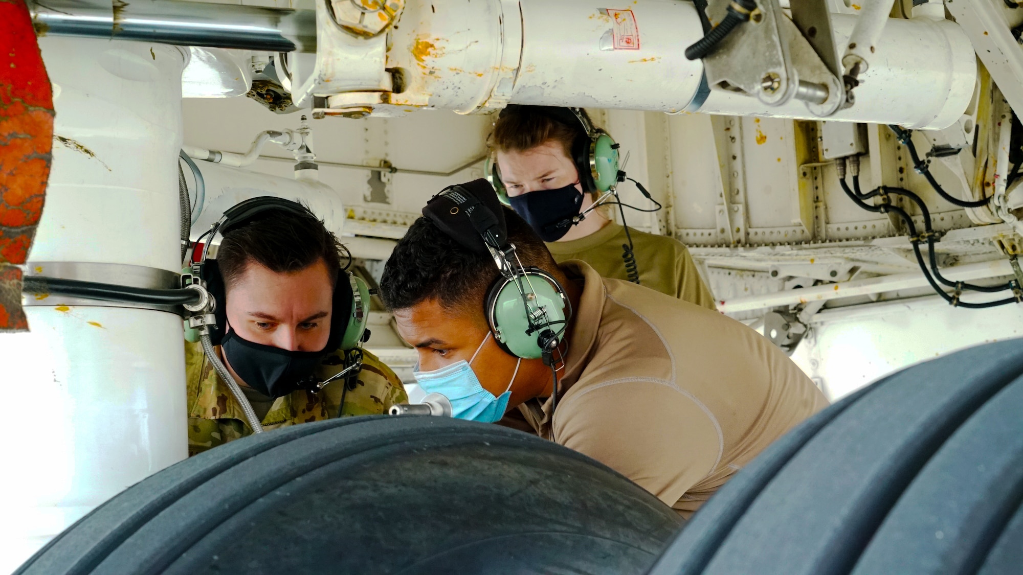 Members assigned to the 22nd Airlift Squadron at Travis Air Force Base, Calif., troubleshoot an aircraft landing gear adjustment after the SBIRS GEO-5 was successfully loaded into the C-5M Super Galaxy aircraft at Moffett Federal Airfield, Calif., Mar. 17, 2021. The C-5M Super Galaxy transported the U.S. Space Force’s Space and Missile Systems Center's SBIRS GEO-5 satellite, part of a missile warning constellation for national defense, to Cape Canaveral for it’s launch later this year. (U.S. Space Force photo by Walter Talens)