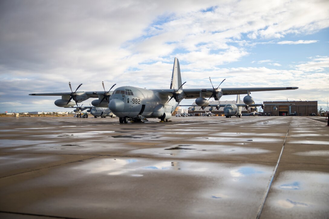 A U.S. Marine Corps KC-130J Hercules crewmember, with Marine Aerial Refueler Transport Squadron (VMGR) 152, oversees the lateral flight movements and combat maneuver training on Marine Corps Air Station Yuma, Jan. 21, 2021. VMGR-152 mission is to provide support by aerial refueling and assault support during expeditionary, joint, or combined operations. (Photo by U.S. Marine Corps Lance Cpl John Hall)