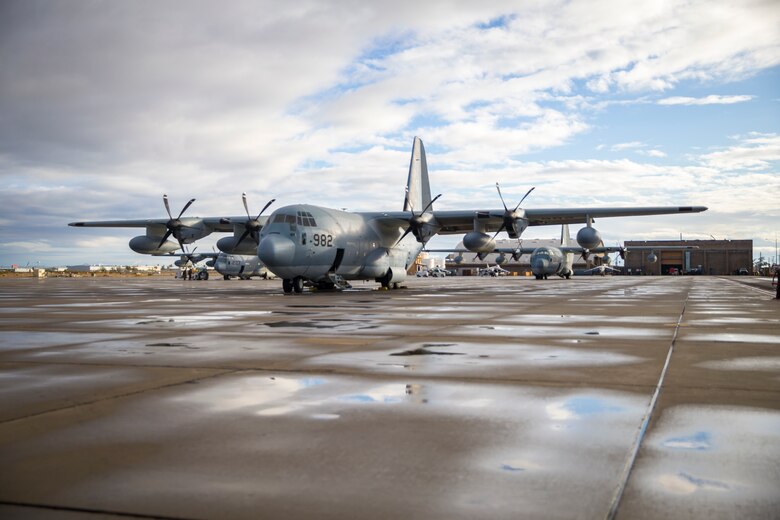 A U.S. Marine Corps KC-130J Hercules crewmember, with Marine Aerial Refueler Transport Squadron (VMGR) 152, oversees the lateral flight movements and combat maneuver training on Marine Corps Air Station Yuma, Jan. 21, 2021. VMGR-152 mission is to provide support by aerial refueling and assault support during expeditionary, joint, or combined operations. (Photo by U.S. Marine Corps Lance Cpl John Hall)