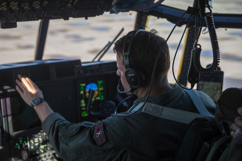 A U.S. Marine Corps KC-130J Hercules crewmember, with Marine Aerial Refueler Transport Squadron (VMGR) 152, oversees the lateral flight movements and combat maneuver training on Marine Corps Air Station Yuma, Jan. 21, 2021. VMGR-152 mission is to provide support by aerial refueling and assault support during expeditionary, joint, or combined operations. (Photo by U.S. Marine Corps Lance Cpl John Hall)