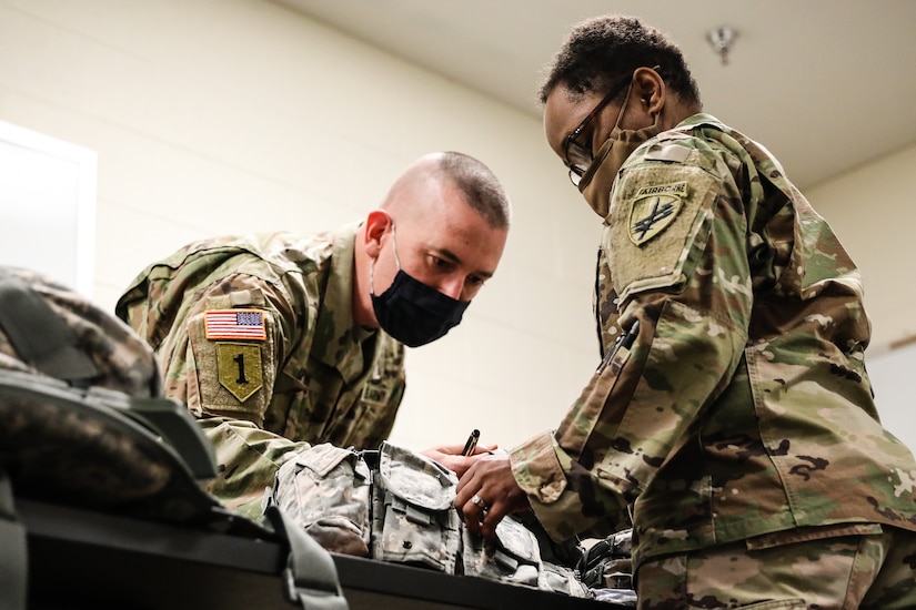 U.S. Army Reserve 1st Sgt. James Upton, right, the first sergeant for Headquarters and Headquarters Company, U.S. Army Civil Affairs and Psychological Operations Command (Airborne), inspects the equipment of a Soldier participating in the in-processing portion of the 2021 USACAPOC (A) Best Warrior Competition at Fort Jackson, S.C. on April 6. Soldiers from across the nation traveled to compete in the 2021 USACAPOC (A) Best Warrior Competition, hosted from April 5-10, at Fort Jackson, S.C. The USACAPOC (A) BWC is an annual competition that brings in the best Soldiers across USACAPOC(A) to earn the title of “Best Warrior” among their peers after being evaluated on their individual ability to adapt and overcome challenging scenarios and battle-focused events, testing their technical and tactical abilities under stress and extreme fatigue.