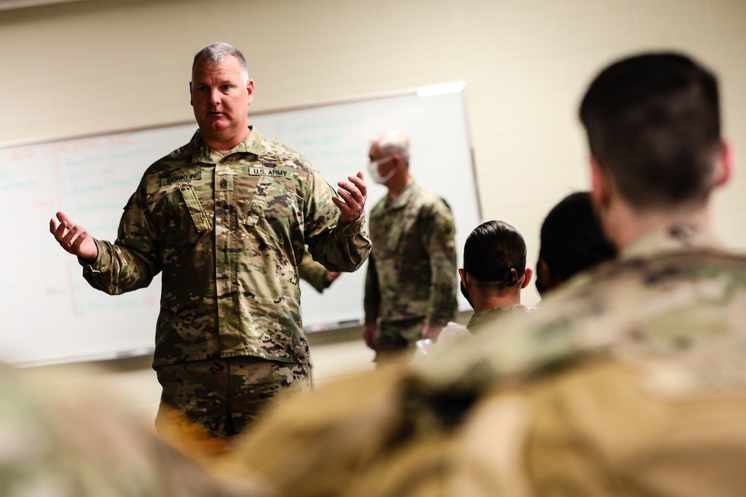 Command Sgt. Maj. George Conklin, a senior enlisted advisor for the 354th Civil Affairs Brigade, U.S. Army Civil Affairs and Psychological Operations Command (Airborne), gives an introductory speech during the in-processing portion of the 2021 USACAPOC (A) Best Warrior Competition at Fort Jackson, S.C. on April 6. Soldiers from across the nation traveled to compete in the 2021 USACAPOC (A) Best Warrior Competition, hosted from April 5-10, at Fort Jackson, S.C. The USACAPOC(A) Best Warrior Competition is an annual competition that brings in the best Soldiers across USACAPOC(A) to earn the title of “Best Warrior” among their peers after being evaluated on their individual ability to adapt and overcome challenging scenarios and battle-focused events, testing their technical and tactical abilities under stress and extreme fatigue.