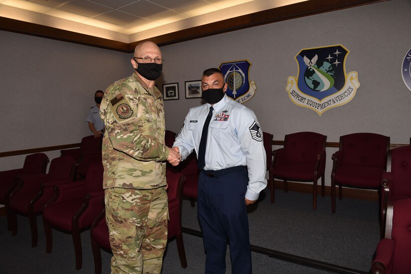 Photo shows the exchanging a coin in a conference room.