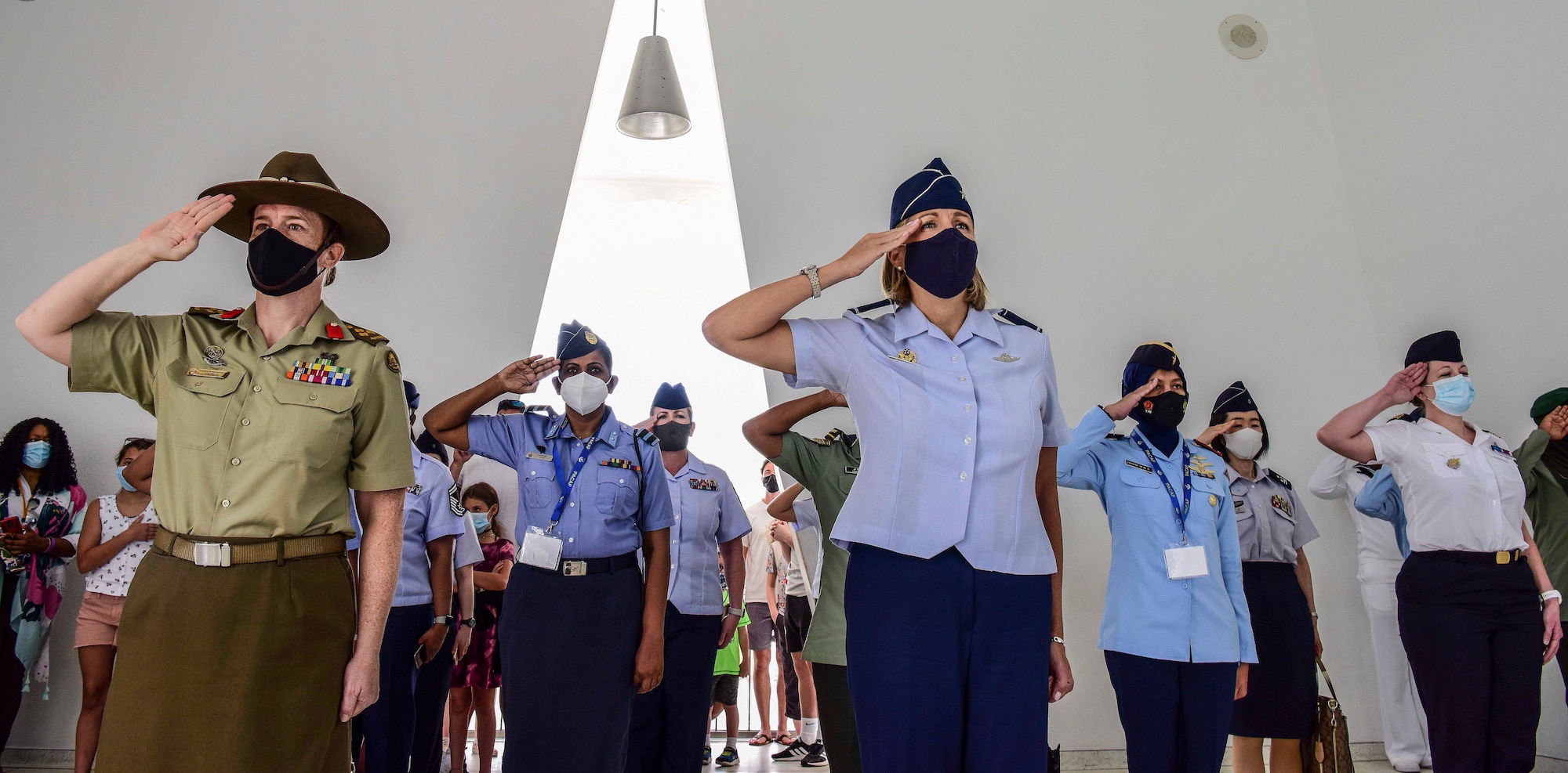 Australian Army Brigadier Nerolie McDonald, U.S. Indo-Pacific Command vice director for Intelligence, and U.S. Air Force Brig. Gen. Jennifer Short, Pacific Air Forces chief of staff, render salutes alongside a flight of multilateral Indo-Pacific partners during a visit to the U.S.S. Arizona Memorial, Honolulu, Hawaii, March 30, 2021. The memorial visit was organized as part of PACAF’s first Women, Peace, and Security symposium, which enabled PACAF Airmen to work alongside partner nations to ensure the safety, security, and the protection of human rights among women and girls, especially during conflict and crisis.