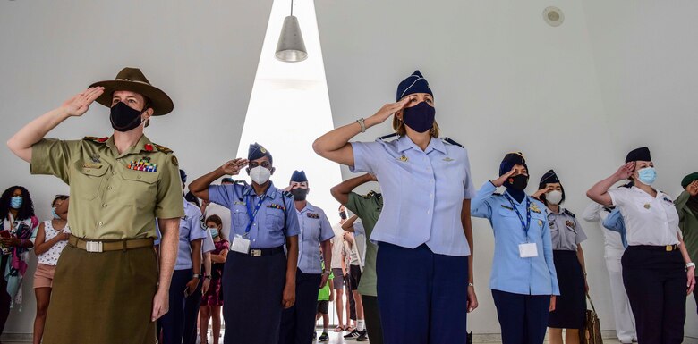 Australian Army Brigadier Nerolie McDonald, U.S. Indo-Pacific Command vice director for Intelligence, and U.S. Air Force Brig. Gen. Jennifer Short, Pacific Air Forces chief of staff, render salutes alongside a flight of multilateral Indo-Pacific partners during a visit to the U.S.S. Arizona Memorial, Honolulu, Hawaii, March 30, 2021. The memorial visit was organized as part of PACAF's first Women, Peace, and Security symposium, which enabled PACAF Airmen to work alongside partner nations to ensure the safety, security, and the protection of human rights among women and girls, especially during conflict and crisis.