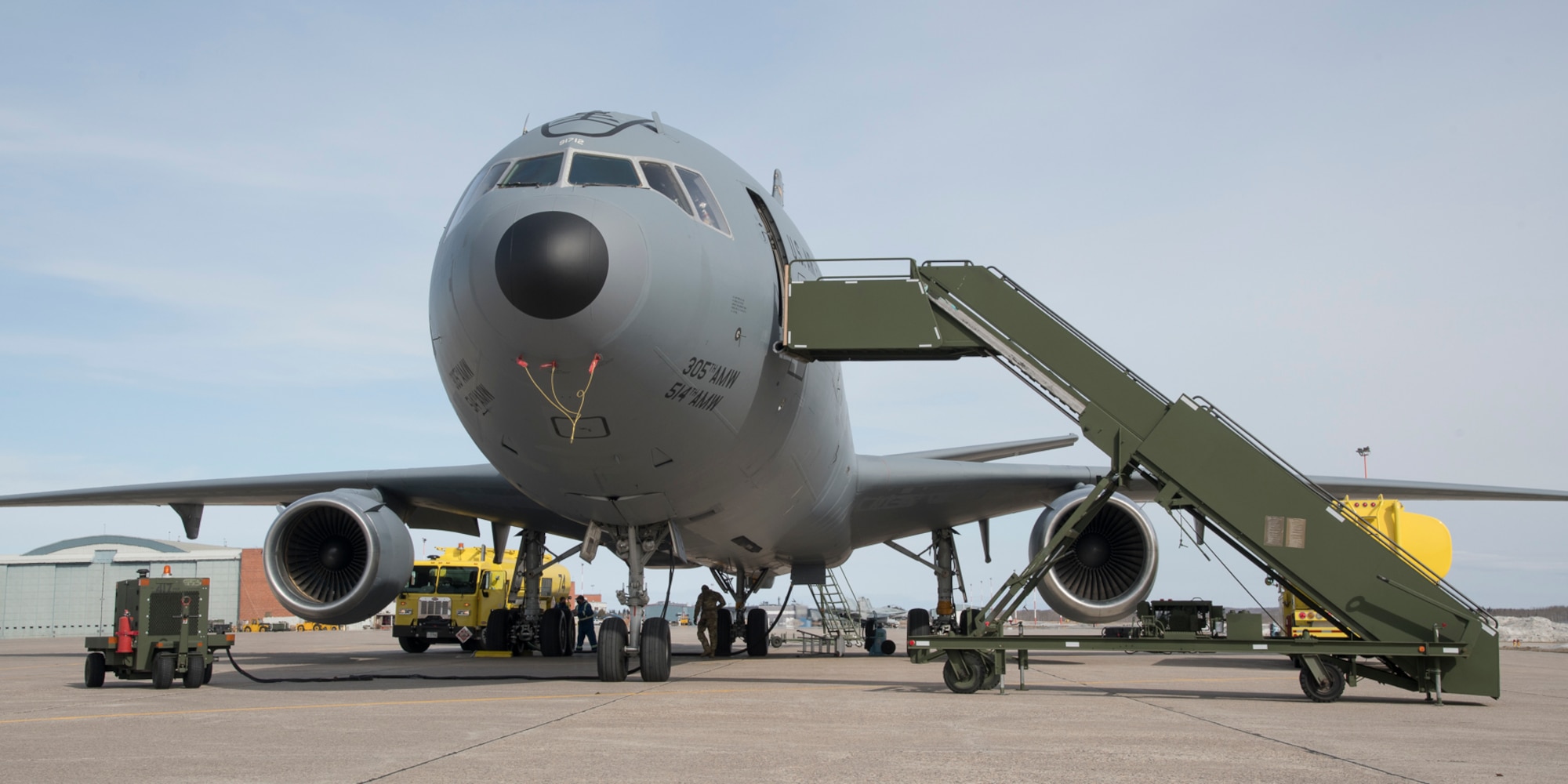 A United States Air Force KC-10 Extender gets refueled before heading to Thule, Greenland for Exercise AMALGAM DART 21-2, outside of Hangar 1, 4 Wing Cold Lake, Alberta, on March 22, 2021.