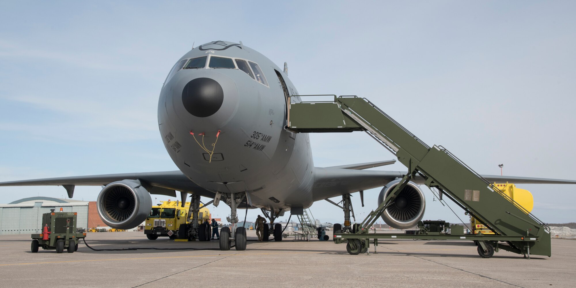 A United States Air Force KC-10 Extender gets refueled before heading to Thule, Greenland for Exercise AMALGAM DART 21-2, outside of Hangar 1, 4 Wing Cold Lake, Alberta, on March 22, 2021.