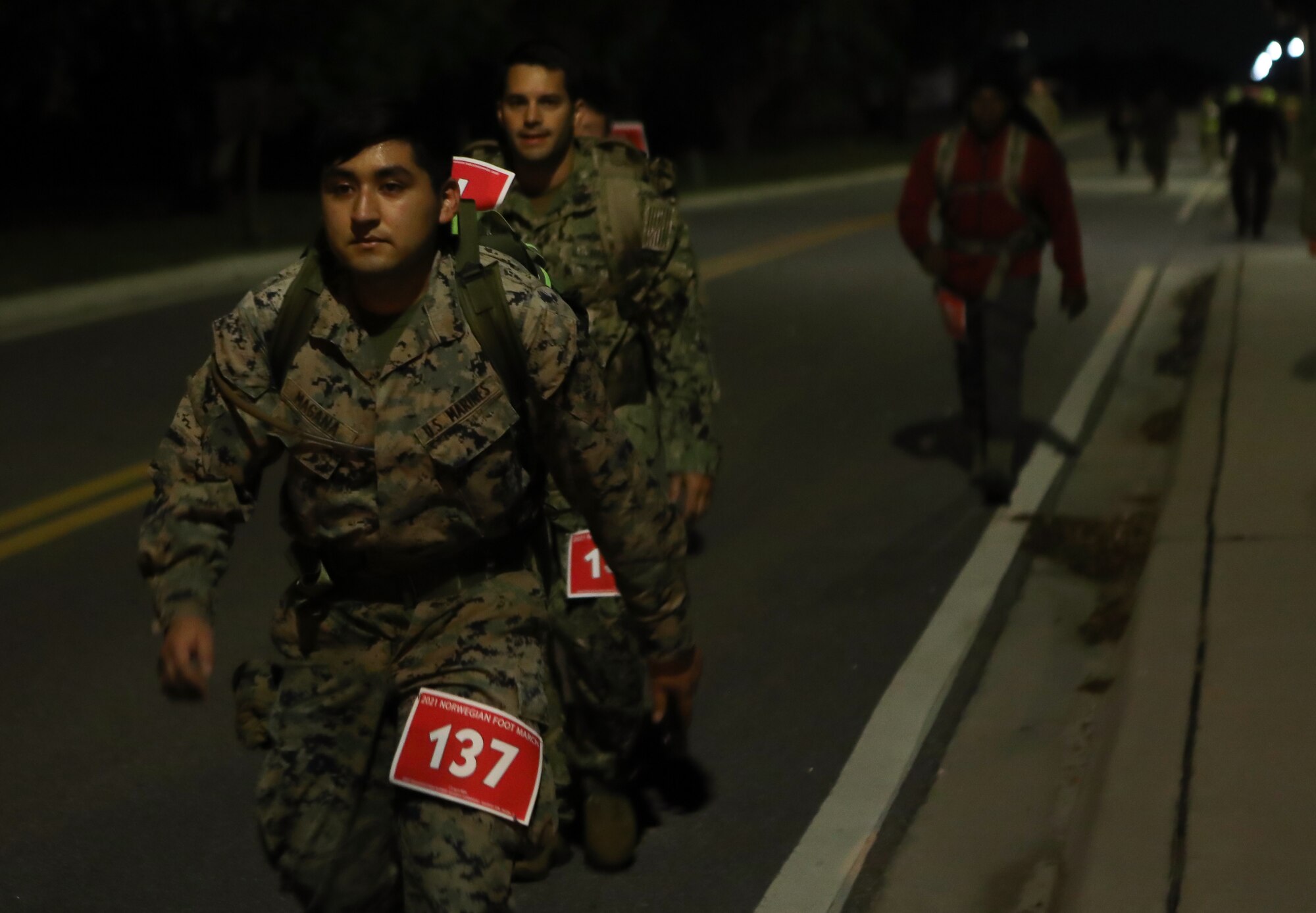 Joint service personnel from U.S. Central Command headquarters and other base commands take part in an early morning Norwegian Foot March at MacDill Air Force Base, April 2, 2021.