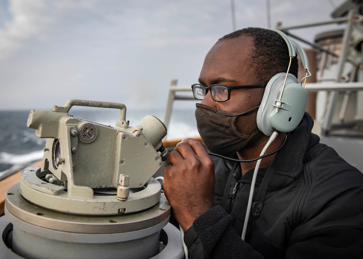 210407-N-HI376-1072 TAIWAN STRAIT (April 7, 2021) Seaman James Bailey, from Greenville, S.C., stands watch on the bridge of the Arleigh Burke-class guided-missile destroyer USS John S. McCain (DDG 56) during routine underway operations. John S. McCain is forward-deployed to the U.S. 7th Fleet area of operations in support of a free and open Indo-Pacific. (U.S. Navy photo by Mass Communication Specialist 1st Class Jeremy Graham)