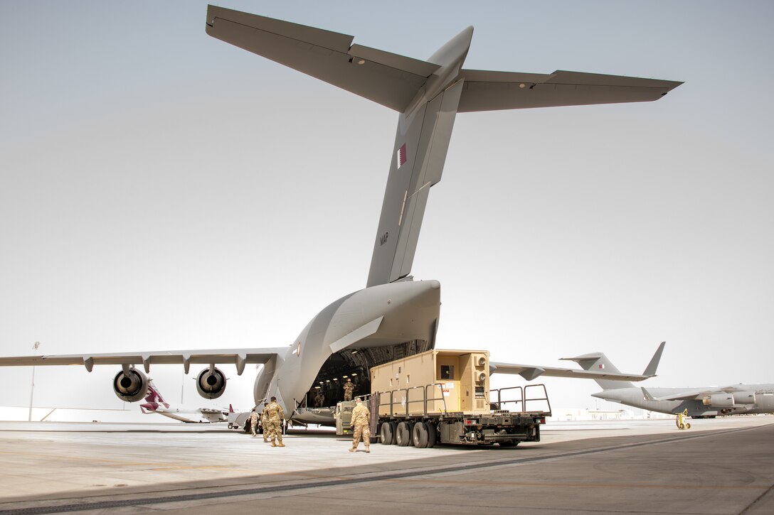 a CONEX is loaded into an airplane