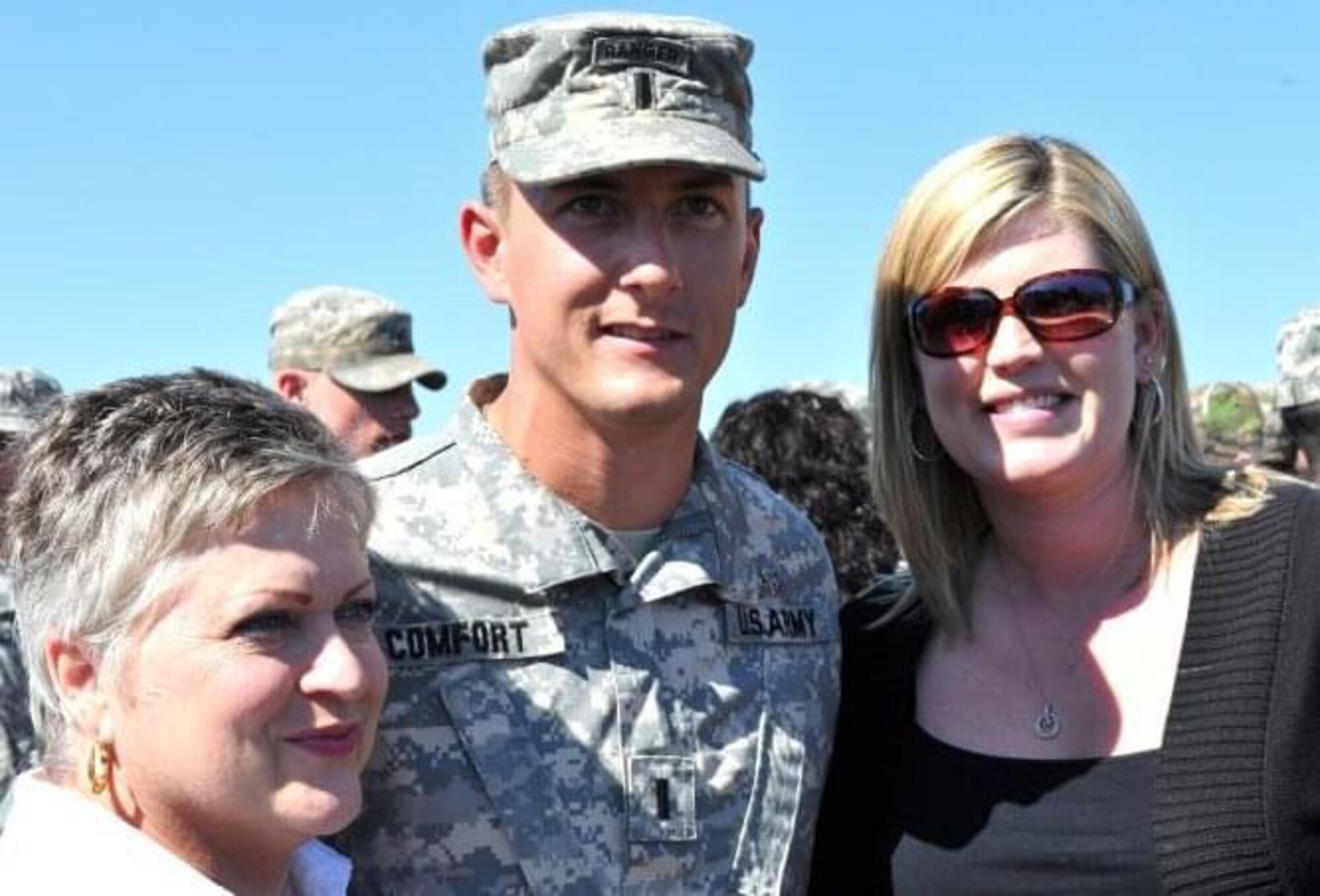 Ellen Comfort, her son Army 1st Lt. Kyle Comfort and his wife Brooke Comfort, enjoy time together after Kyle’s graduation from Airborne School in March 2010.