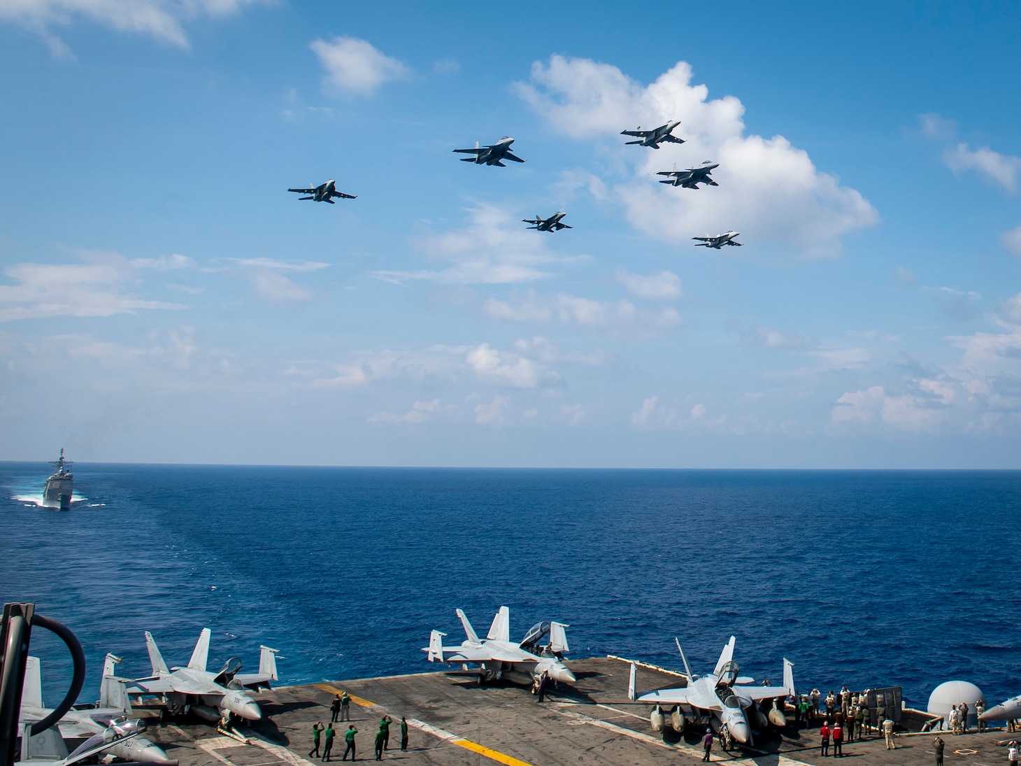 Aircraft from Carrier Air Wing (CVW) 11 and the Royal Malaysian Air Force (RMAF) fly above the aircraft carrier USS Theodore Roosevelt (CVN 71).