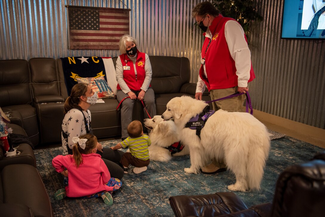 Therapeutic doges attend the USO of North Carolina reopening at Seymour Johnson Air Force Base, North Carolina, April 01, 2021