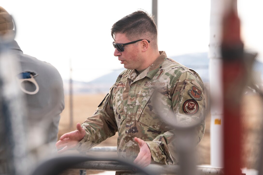 Senior Airman Ruel Gomez, 341st Missile Maintenance Squadron missile maintenance trainee, studies a technical order March 27, 2021, at a launch facility near Malmstrom Air Force Base, Mont.