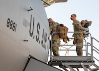 Airmen loading into airplane