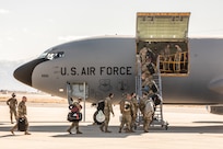 Airmen loading into airplane.