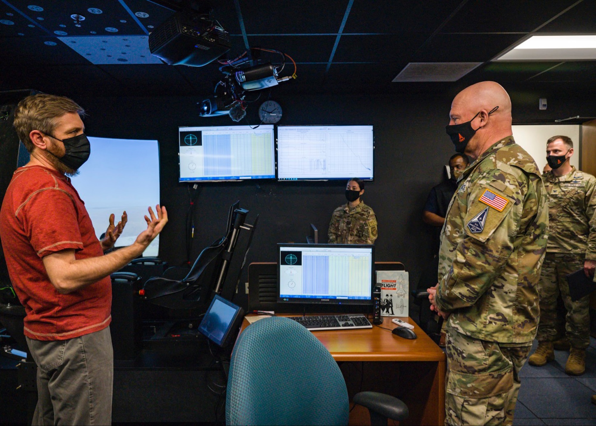 United States Space Force Gen. John W. “Jay” Raymond, Chief of Space Operations, receives a tour of a flight simulator at the Air Force Test Pilot School at Edwards Air Force Base, California, April 6. (Air Force photo by Giancarlo Casem)