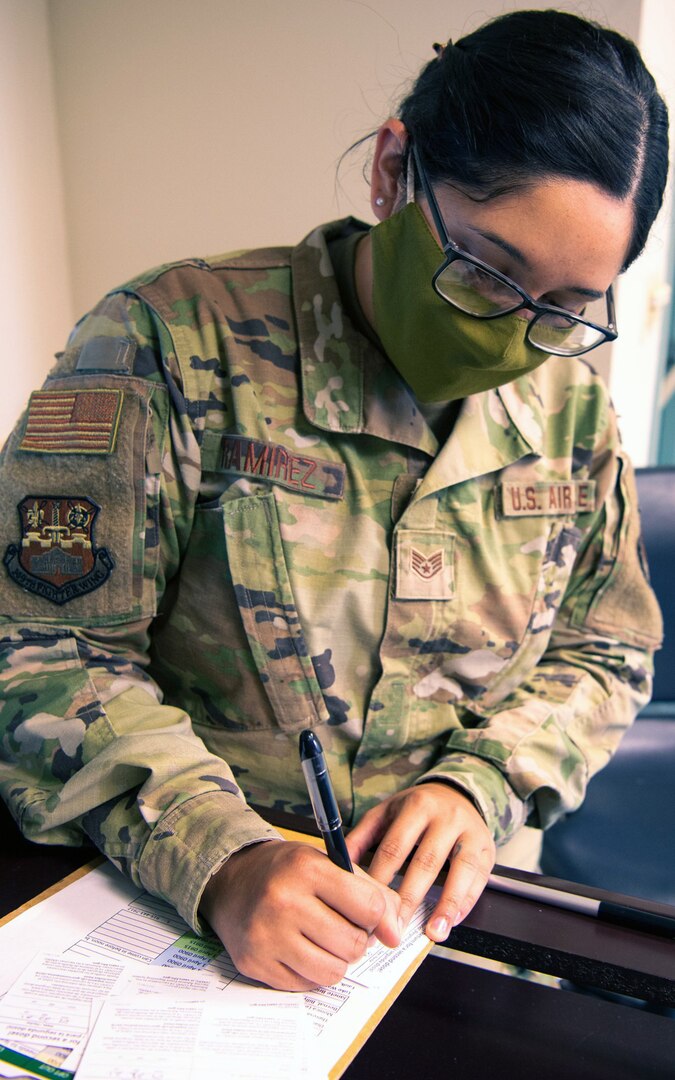 Staff Sgt. Sandra Ramirez, 149th Medical Group health systems technician, prepares vaccination cards April 1 for that day’s COVID-19 vaccination recipients. The 149th MDG is holding weekly COVID-19 vaccination clinics for all eligible beneficiaries.
