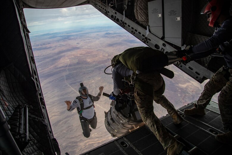 U.S. Marines and Army SOF conduct barrel drops and tandem jumps out of a KC-130J at Yuma Proving Grounds on February 9, 2021. This training teaches them how to jump with personnel or equipment in order to expand their mission capabilities.(U.S. Marine Corps photo by LCpl. Gabrielle Sanders)