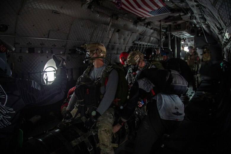 U.S. Marines and Army SOF conduct barrel drops and tandem jumps out of a KC-130J at Yuma Proving Grounds on February 9, 2021. This training teaches them how to jump with personnel or equipment in order to expand their mission capabilities.(U.S. Marine Corps photo by LCpl. Gabrielle Sanders)