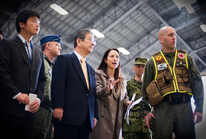 YOKOTA AIR BASE, Japan -- Capt. Klusmann, initial response force commander, provides Toshimi Kitazawa, Japan Minister of Defense, a demonstration of IRF functions at Hangar 15 here April 23.  The specialized team deployed to Yokota and remains on stand-by to support the Government of Japan if requested. (U.S. Air Force photo/Staff Sgt. Chad C. Strohmeyer)