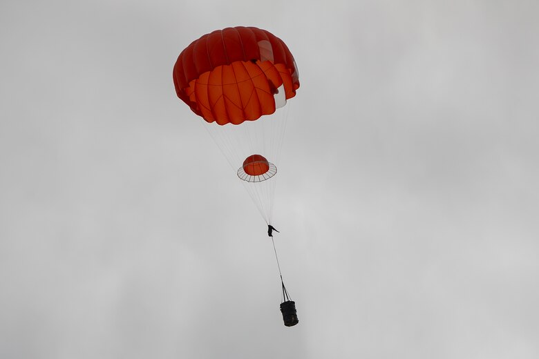 U.S. Marines and Army SOF conduct barrel drops and tandem jumps out of a KC-130J at Yuma Proving Grounds on February 9, 2021. This training teaches them how to jump with personnel or equipment in order to expand their mission capabilities.(U.S. Marine Corps photo by LCpl. Gabrielle Sanders)