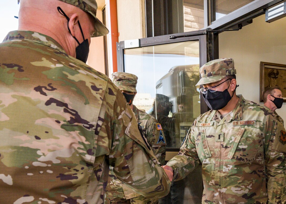 General Raymond coins 1st Lt. Francis Ambion