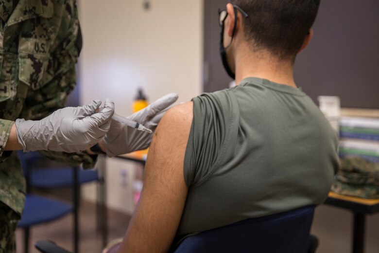 U.S. Marines stationed on Marine Corps Air Station (MCAS) Yuma, receive their COVID-19 vaccination on MCAS Yuma, Ariz., Feb. 16, 2021. Vaccines are being administered in phased approach, prioritizing healthcare workers and first responders, as well as mission critical and deploying personnel. The vaccine is voluntary and Marines are receiving it in order to keep the Corps mission ready. (U.S. Marine Corps photo by Lance Cpl John Hall)