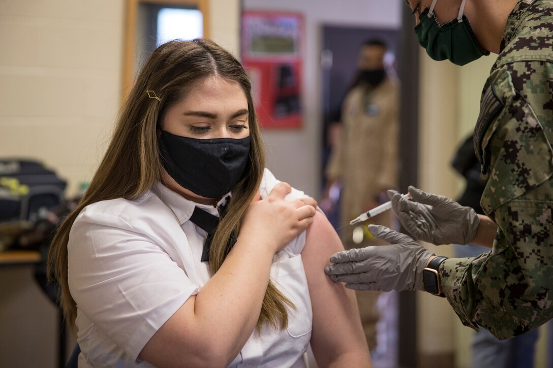 U.S. Marines stationed on Marine Corps Air Station (MCAS) Yuma, receive their COVID-19 vaccination on MCAS Yuma, Ariz., Feb. 16, 2021. Vaccines are being administered in phased approach, prioritizing healthcare workers and first responders, as well as mission critical and deploying personnel. The vaccine is voluntary and Marines are receiving it in order to keep the Corps mission ready. (U.S. Marine Corps photo by Lance Cpl John Hall)