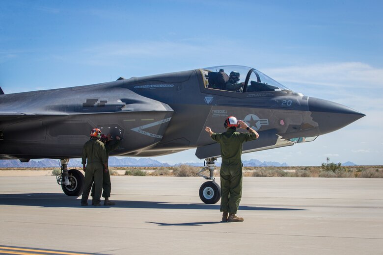 U.S. Marines with Marine Aircraft Group (MAG) 13 conduct refueling operations during a Strike Coordination and Reconnaissance (SCAR) mission aboard a simulated naval vessel at KNOZ range, Yuma, AZ., March 4, 2021. The large-force exercise was implemented in order to project the capabilities of "island hopping" and consisted of multiple MAG-13 assets, including ground support from Marine Wing Support Squadron (MWSS) 371 and aircraft from Marine Fighter Attack Squadron (VMFA) 122. (U.S. Marine Corps photo by Lance Cpl John Hall)