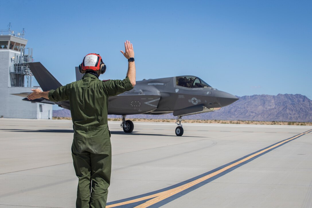 U.S. Marines with Marine Aircraft Group (MAG) 13 conduct refueling operations during a Strike Coordination and Reconnaissance (SCAR) mission aboard a simulated naval vessel at KNOZ range, Yuma, AZ., March 4, 2021. The large-force exercise was implemented in order to project the capabilities of "island hopping" and consisted of multiple MAG-13 assets, including ground support from Marine Wing Support Squadron (MWSS) 371 and aircraft from Marine Fighter Attack Squadron (VMFA) 122. (U.S. Marine Corps photo by Lance Cpl John Hall)