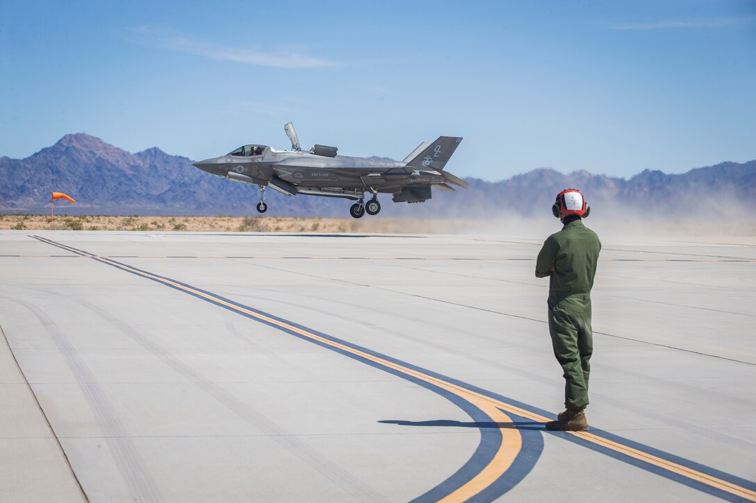 U.S. Marines with Marine Aircraft Group (MAG) 13 conduct refueling operations during a Strike Coordination and Reconnaissance (SCAR) mission aboard a simulated naval vessel at KNOZ range, Yuma, AZ., March 4, 2021. The large-force exercise was implemented in order to project the capabilities of "island hopping" and consisted of multiple MAG-13 assets, including ground support from Marine Wing Support Squadron (MWSS) 371 and aircraft from Marine Fighter Attack Squadron (VMFA) 122. (U.S. Marine Corps photo by Lance Cpl John Hall)