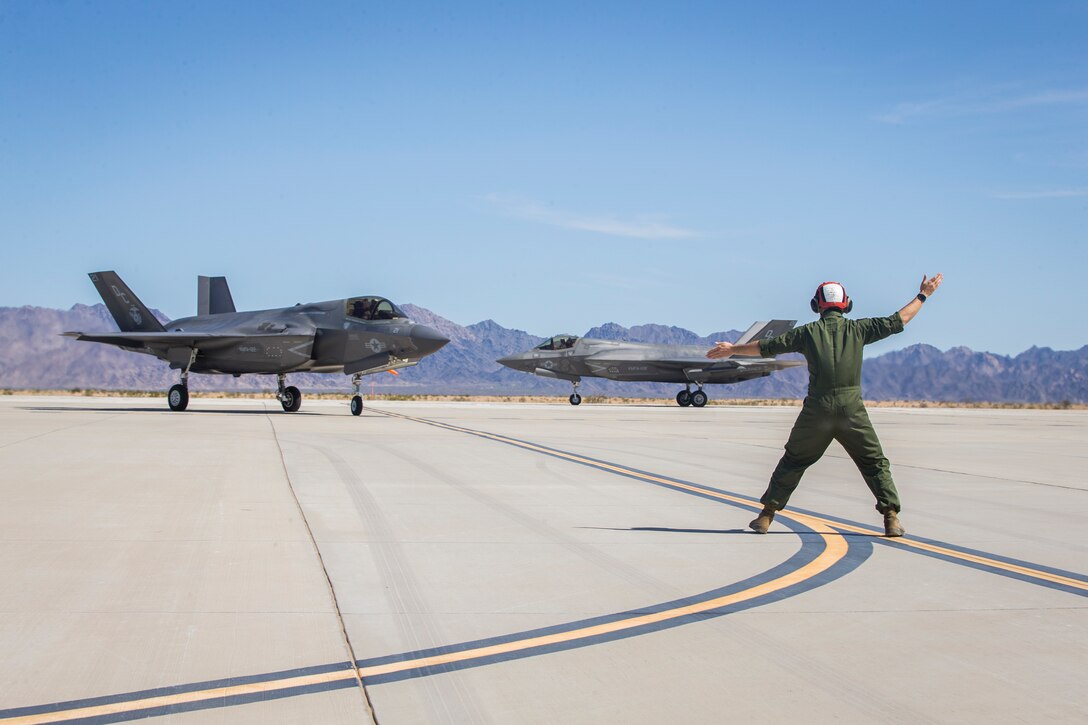 U.S. Marines with Marine Aircraft Group (MAG) 13 conduct refueling operations during a Strike Coordination and Reconnaissance (SCAR) mission aboard a simulated naval vessel at KNOZ range, Yuma, AZ., March 4, 2021. The large-force exercise was implemented in order to project the capabilities of "island hopping" and consisted of multiple MAG-13 assets, including ground support from Marine Wing Support Squadron (MWSS) 371 and aircraft from Marine Fighter Attack Squadron (VMFA) 122. (U.S. Marine Corps photo by Lance Cpl John Hall)