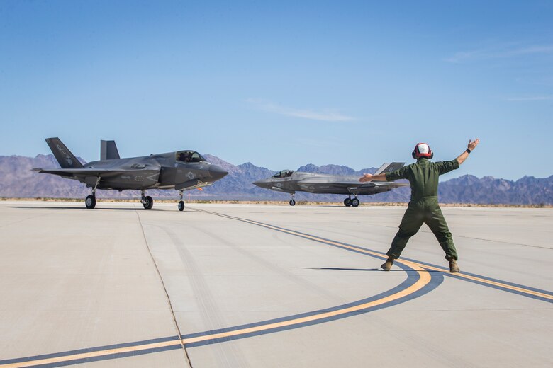 U.S. Marines with Marine Aircraft Group (MAG) 13 conduct refueling operations during a Strike Coordination and Reconnaissance (SCAR) mission aboard a simulated naval vessel at KNOZ range, Yuma, AZ., March 4, 2021. The large-force exercise was implemented in order to project the capabilities of "island hopping" and consisted of multiple MAG-13 assets, including ground support from Marine Wing Support Squadron (MWSS) 371 and aircraft from Marine Fighter Attack Squadron (VMFA) 122. (U.S. Marine Corps photo by Lance Cpl John Hall)