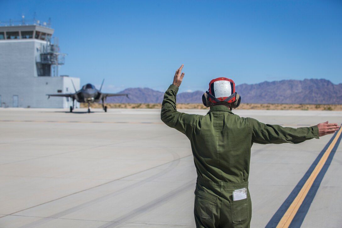 U.S. Marines with Marine Aircraft Group (MAG) 13 conduct refueling operations during a Strike Coordination and Reconnaissance (SCAR) mission aboard a simulated naval vessel at KNOZ range, Yuma, AZ., March 4, 2021. The large-force exercise was implemented in order to project the capabilities of "island hopping" and consisted of multiple MAG-13 assets, including ground support from Marine Wing Support Squadron (MWSS) 371 and aircraft from Marine Fighter Attack Squadron (VMFA) 122. (U.S. Marine Corps photo by Lance Cpl John Hall)